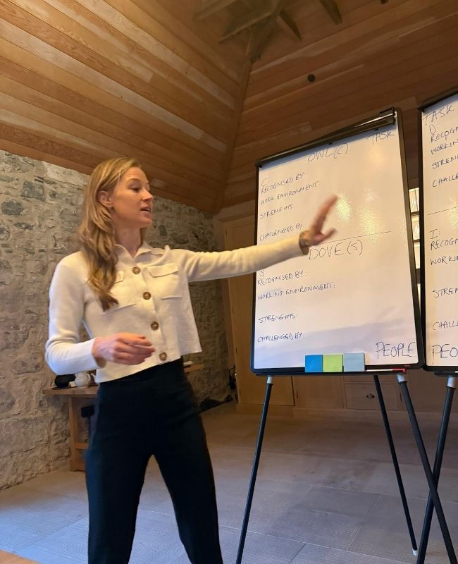 Jess at the flip chart during a leadership workshop